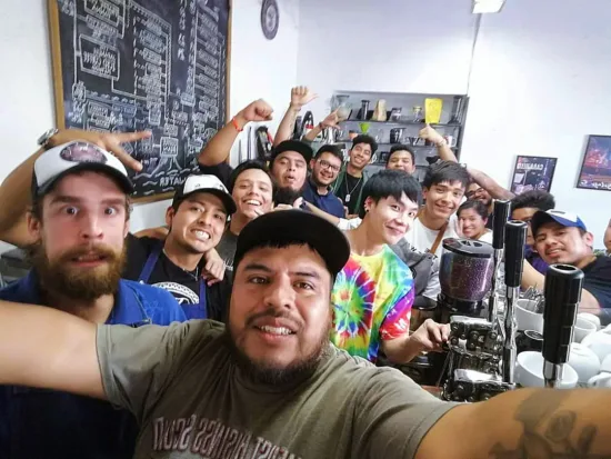 gerson poses with many employees inside fat cat.