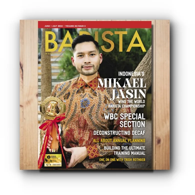 June + July 2024 Issue of Barista Magazine on a wooden background.