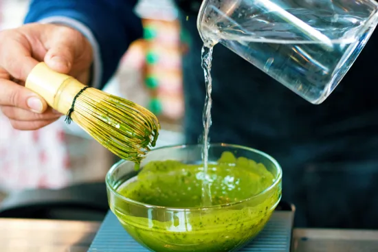 Matcha being whisked.