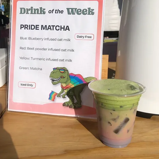 A colorful matcha with tumeric, beet powder, and blueberry infused oat milk.
