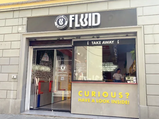 Fluid's exterior has wavy lettering and a sign that says "Curious? Have a look inside."