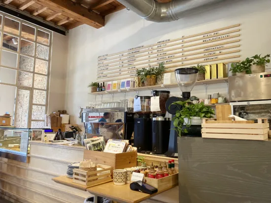 The Scandinavian-inspired neutral-colored interior of Melaleuca, with open shelving ang plants throughout.