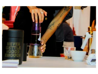 Champ Danny Toro plunges the AeroPress during competition.