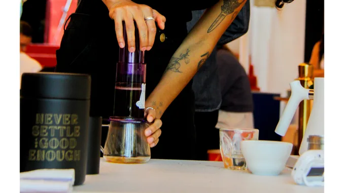 Champ Danny Toro plunges the AeroPress during competition.