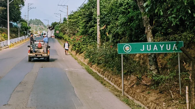 A road sign that reads Juayua