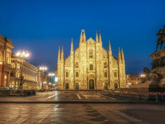 View of a cathedral in a city square.