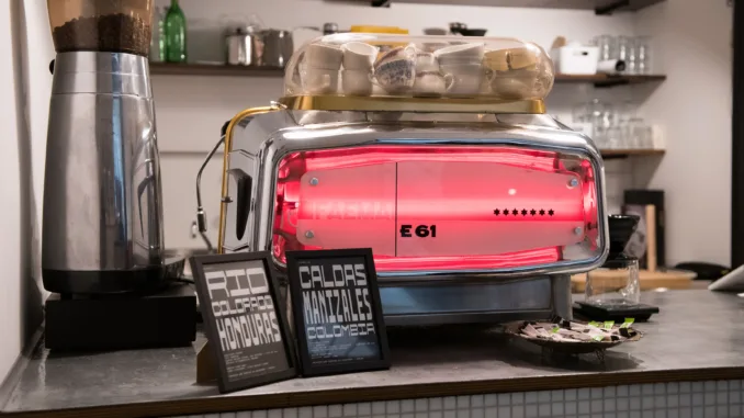 Pressato's bright red espresso machine.