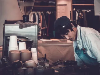 A barista works solo.