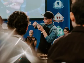 Dylan pouring a latte during competition.