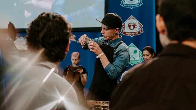 Dylan pouring a latte during competition.