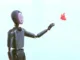 A humanoid robot reaches out to a pink butterfly.