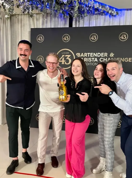 The Bartender & Barista Challenge 2024 champion Julia Engel poses with the judges.