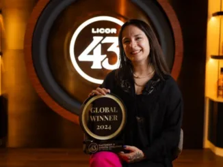 Julia Engel poses with her Licor 43 Bartender & Barista Challenge trophy.