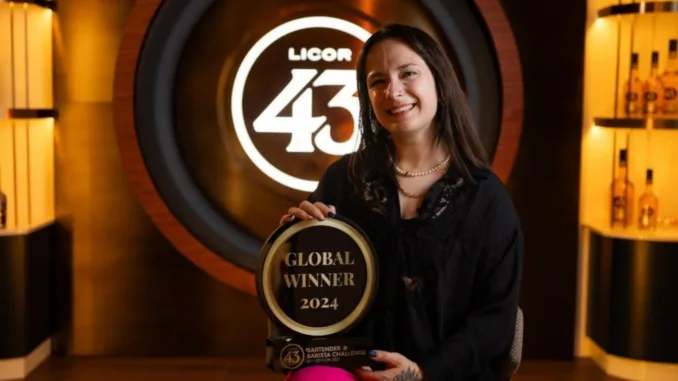 Julia Engel poses with her Licor 43 Bartender & Barista Challenge trophy.