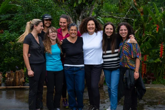 A group of women gather for a photo.