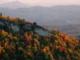 A North Carolina mountain ridge dotted with colorful autumn trees.