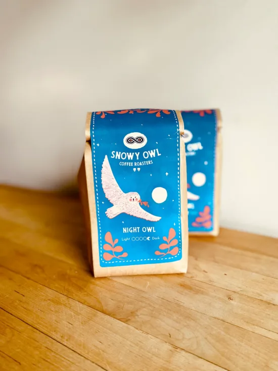 Coffee packaging with a white owl.