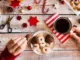 Holiday wrapping and cookies with a coffee cup.